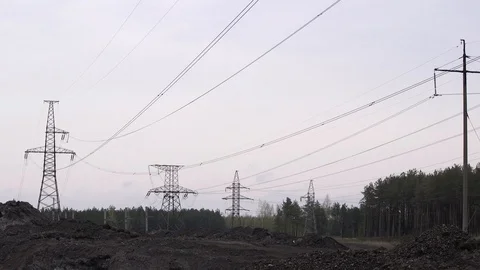 Electric poles in a career Stock Footage 99178993