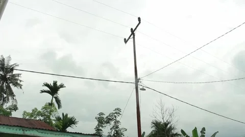 Electric poles on a cloudy sky background Stock Footage 196567059