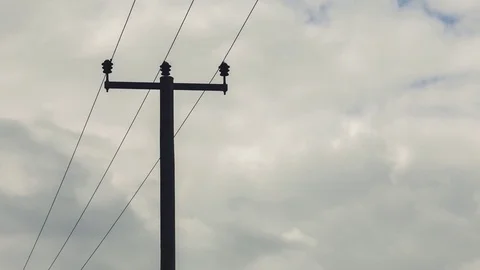 Electric poles in a field Stockbeeldmateriaal 83678261