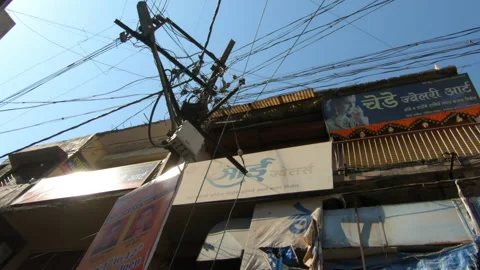 Electric poll with messy cable near residential house, Amravati, India Stock Footage 152121123