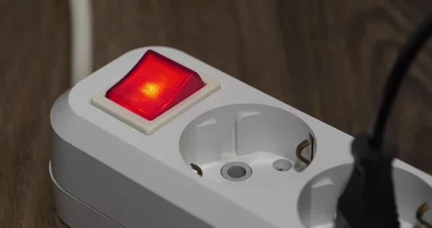 Electric portable socket with red power and on indicator. Cinema 4K 60fps video Vídeos de archivo 312071762