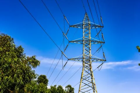 Electric Post and Wires in the Background of Blue Sky Stock Photos