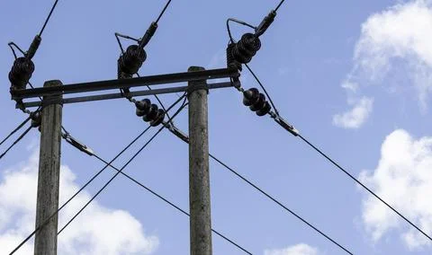 An electric post with a cloudy sky background Foto stock