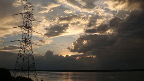 Electric power with clouds and river Stockbeeldmateriaal 87968315