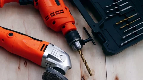 Electric power drill and sander on wooden background Stock-Footage 209965360