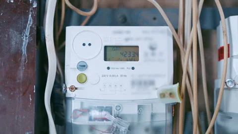 Electric Power Meter with Changing LCD Display Readings Mounted in Home Fuse Box Stock Footage 333019026