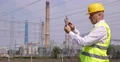 Electric Power Plant Technician Man Analyzing Touch Pad Electricity Distribution 4k or 4k+ Resolution