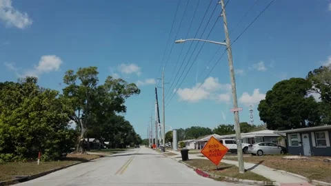 Electric Power Pole Construction Blue Sky 4K From car driving forward Stock Footage 237544017