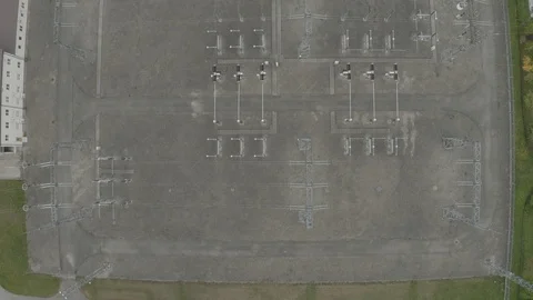 Electric Power Transformator Station in the field in the city Drone 4K shot Vídeos de archivo 118990079
