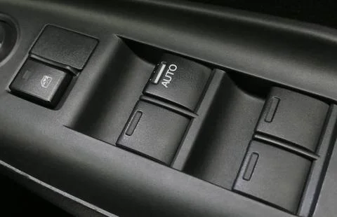 Electric power window control panel. Modern car interior Stock Photos