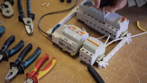 Electric produces hook up from the opening of switchboard Stock-Footage 74227391