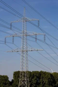 Electric pylon in the landscape. Non urban scene with power poles and and ... Stock Photos