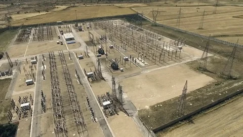Electric pylons, architectural structure of a power plant. aerial video. Stock Footage 70399498