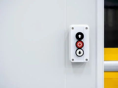 Electric roller shutter door switch with up, down and stop buttons, switch .. Stock Photos