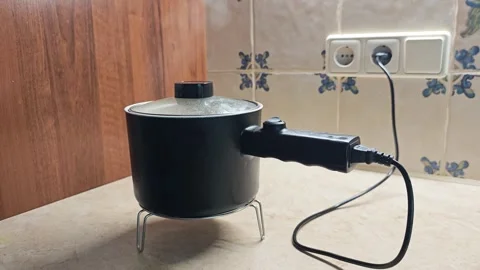 Electric saucepan in the kitchen Stock Footage 280789230