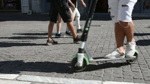 Electric scooter passing in front of the camera Stock Footage 113012742