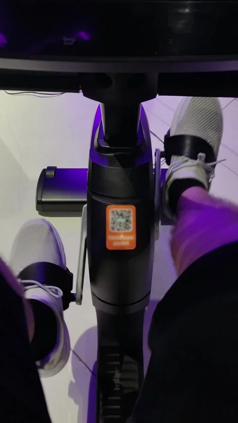 Electric scooter with QR code and rider's feet under purple lighting Stock-Footage 347169574