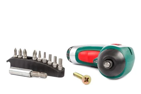 Electric screwdriver with interchangeable bits on white background. Foto stock