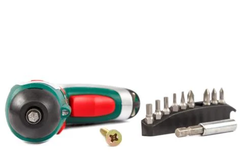 Electric screwdriver with interchangeable bits on white background. Stock Photos