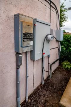 Electric service panels on building Stock Photos