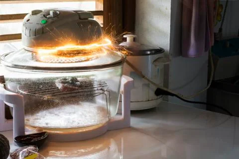 Electric shock Oven Therefore causing sparks Dangerous concepts from the use  Fotos de archivo