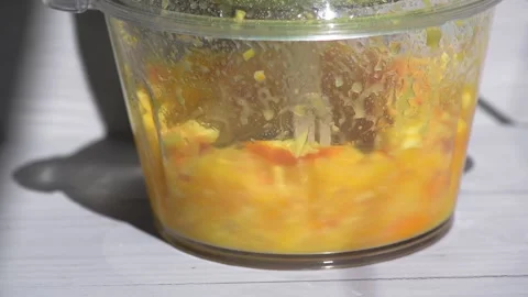 Electric shredder crushes the orange Stock Footage 154687004