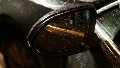 Electric side mirror adjustment. At night, the surface of the car's side mirror Stock Footage 325697140