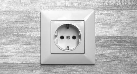 Electric socket on gray wall close-up, EU socket in modern interior photo Stock Photos