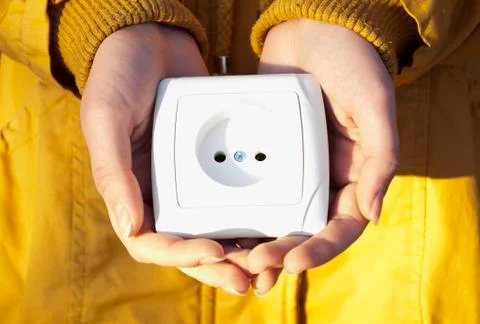 Electric socket in hands. Stock Photos