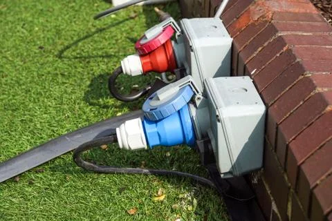 An electric socket timer with cord attached. This one is used outdoors in damp Stock Photos