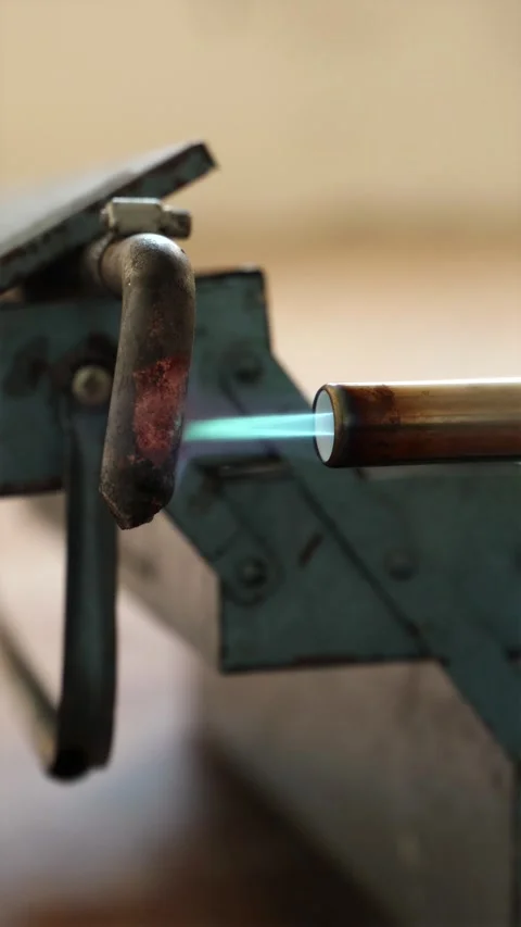 Electric soldering iron heating up on workstation vertical Stock Footage 339298287