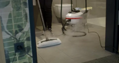 Electric Steam Cleaner Sanitizing a Bathroom Tile Floor 库存影片 340272218