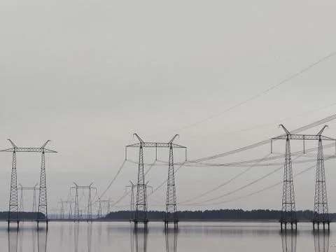 Electric supports in the pond.  Power line Stock Photos