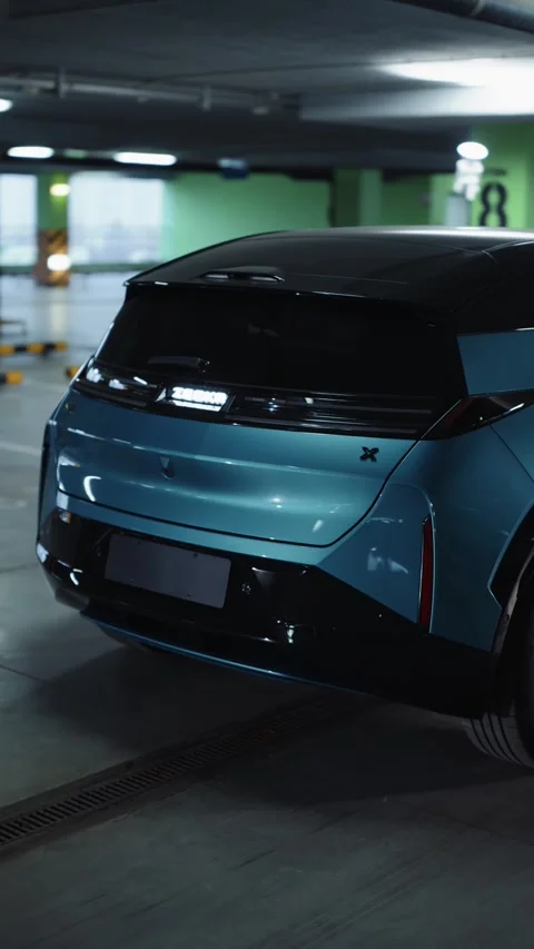 Electric SUV rear view in underground parking lot 스톡 동영상 318417680