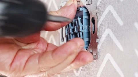 Electric switch installation process in residential setting Stock Footage 307611223