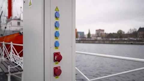 Electric switchboard close - up on the river bank next to the boat. Stock Footage 256156483