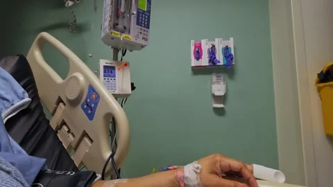 Electric syringe pump administering morphine, Hospital ICU, Hand connected .. Видео 266610083