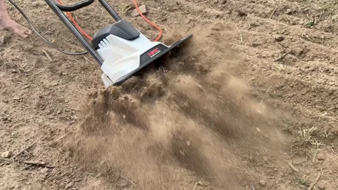Electric Tiller in Action: Preparing Soil for Vegetables Video stock 278149681