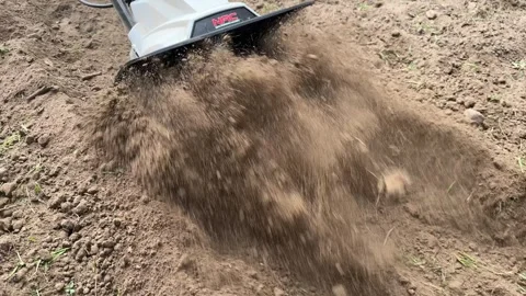 Electric Tiller in Action: Preparing Soil for Vegetables Stock-Footage 278154559