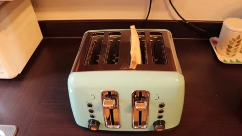 Electric toaster bread cooked between heated element Video stock 139756321