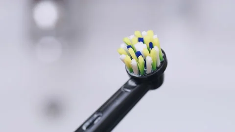 Electric toothbrush in bathroom Stock Footage 204000416