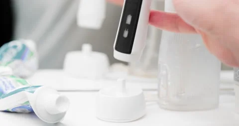 Electric toothbrush in bathroom Stock Footage 204000717