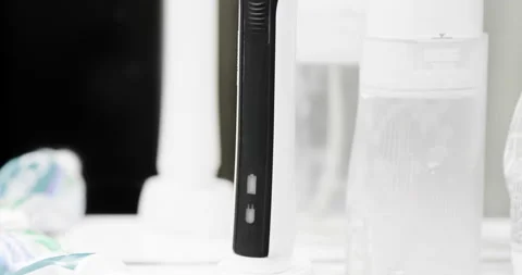 Electric toothbrush in bathroom Stock Footage 230625140