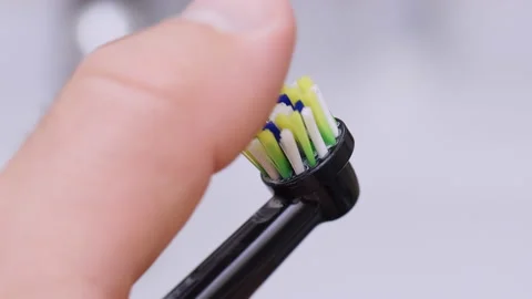 Electric toothbrush in bathroom Stock Footage 238364777