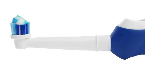 Electric toothbrush with paste on white background, closeup 스톡 사진