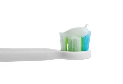 Electric toothbrush with paste on white background, closeup 스톡 사진
