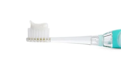 Electric toothbrush with paste on white background, closeup 스톡 사진