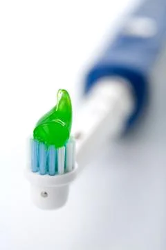 Electric toothbrush with toothpaste Stock Photos