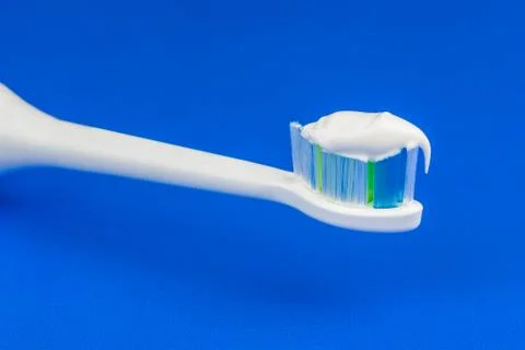 Electric toothbrushe and toothpaste Stock Photos