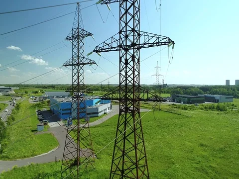 Electric towers on green grass. Summer, day. Stock Footage